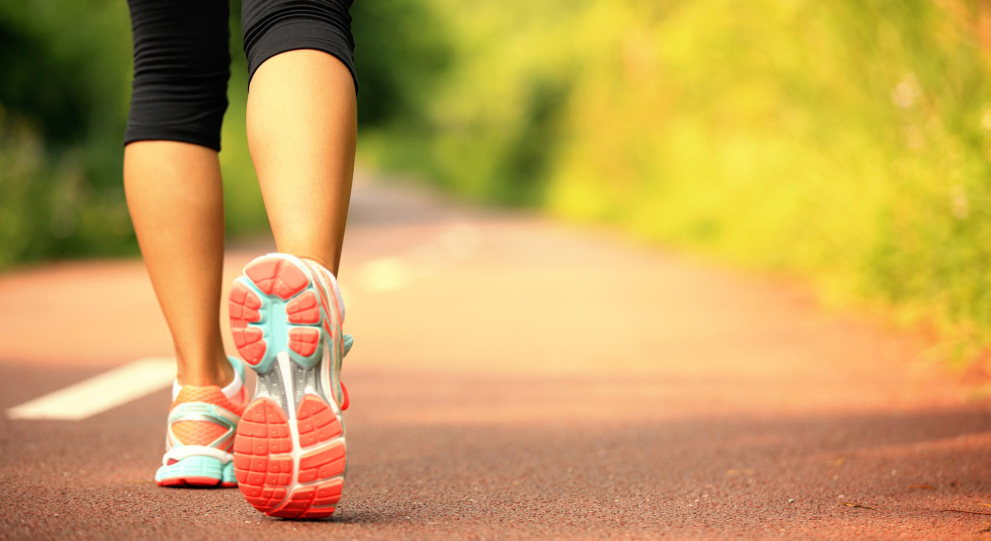 Person practicing yoga indoors in a calm, focused environment with soft lighting.